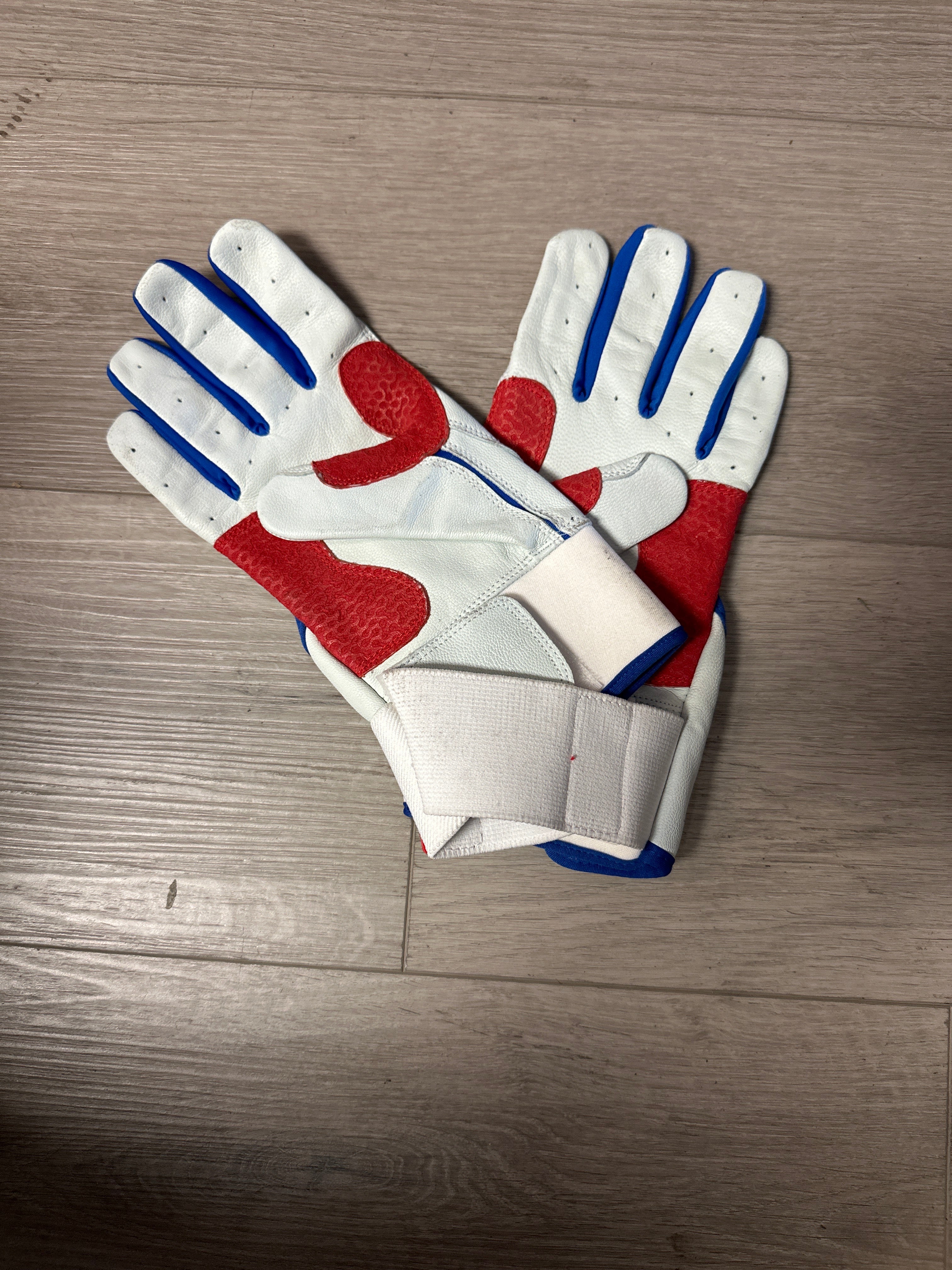 Red and blue batting gloves on sale